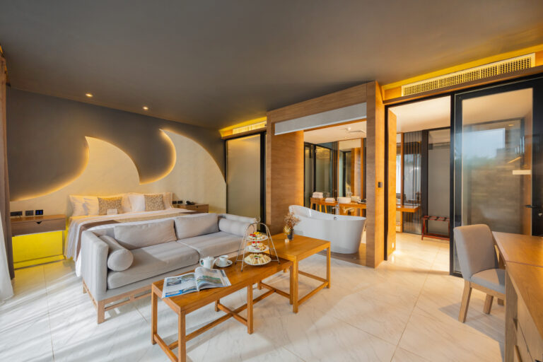 Seating area and bed in Samutra, a one bedroom pool villa at The Yana Villas Hua Hin